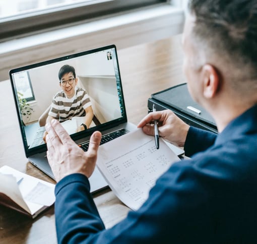 two men talking over a videocall